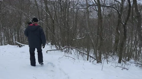 A Bearded Man With a Steadicam in His Hands Walking Along the Slopes of the Stock Footage 59024865