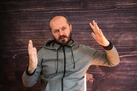 Bearded man in studio talking to camera, video blogging concept Fotos Stock