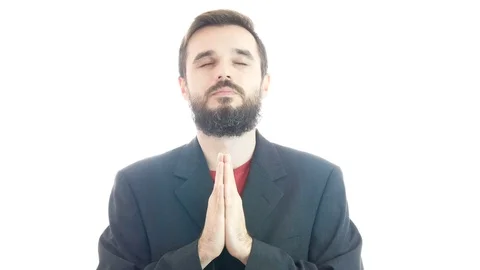 Bearded man in suit praying and looking up 库存影片 71591981