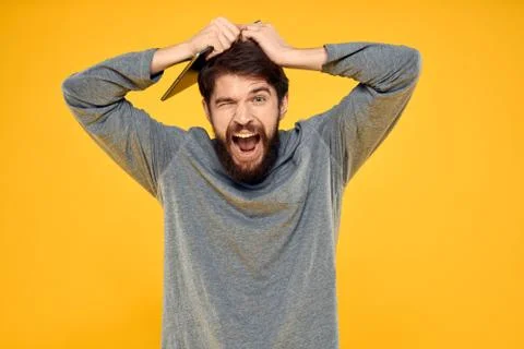 Bearded man with tablet in hands technology work wireless device yellow Stock Photos