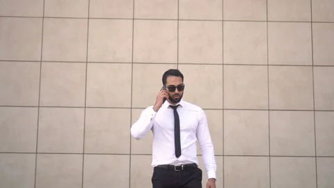 Bearded Man Talking by Phone Stockbeeldmateriaal 91792101