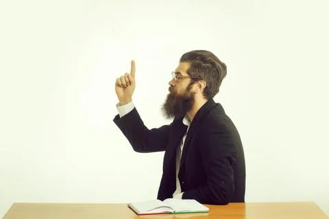 Bearded man teacher at table Stock Photos