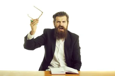Bearded man teacher at table Stock Photos