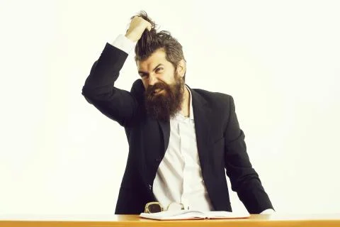 Bearded man teacher at table Stock Photos