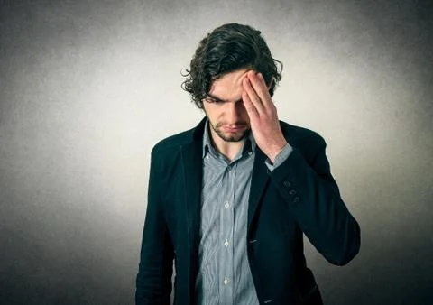 Bearded man thinking or has head pain Stock Photos