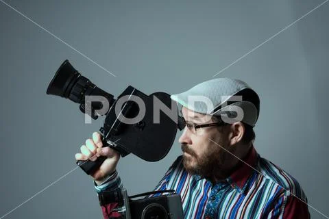 Bearded man two old retro film camera Stock Photos