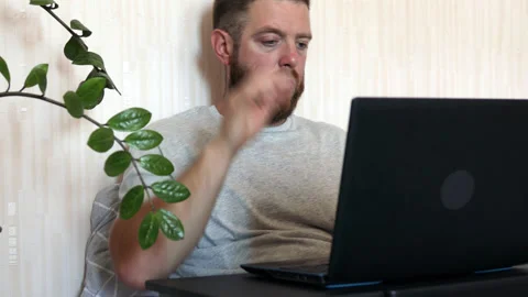 Bearded man typing on laptop doing research. Stock Footage 156705483