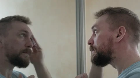 A bearded man uses gouache Stock Footage 153736804