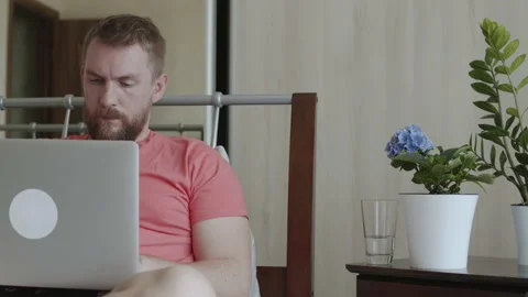 Bearded man using laptop at home Stock Footage 155217275