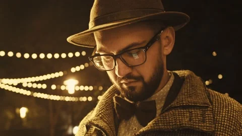 Bearded man is using phone and typing message at table in cafe. Young guy is Stock Footage 155689579