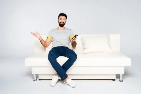 Bearded man using smartphone Stock Photos