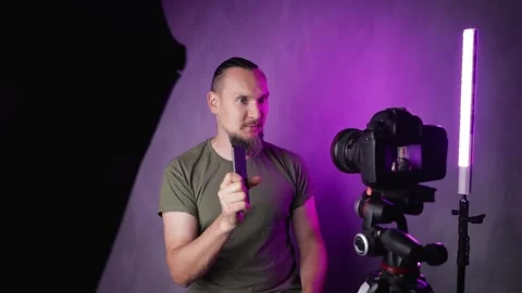 Bearded man vlogger talking in front of camera Stock Footage 156556390
