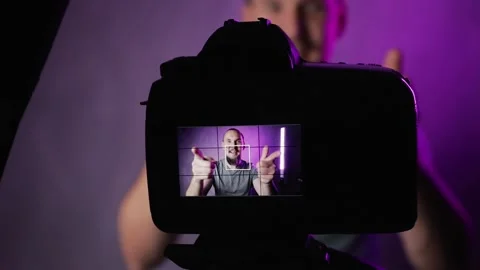 Bearded man vlogger talking in front of camera Stock Footage 156556977