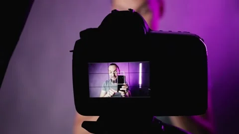 Bearded man vlogger talking in front of camera Stock Footage 156557064