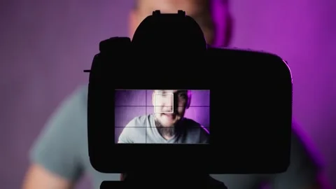 Bearded man vlogger talking in front of camera Stock Footage 156557380