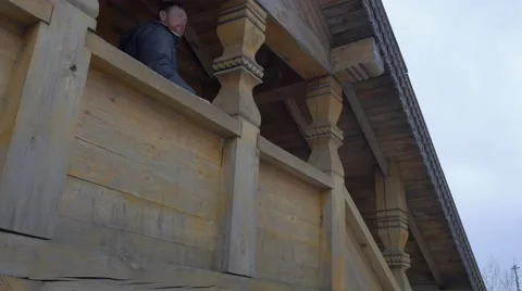 Bearded Man Walking Downstairs Wooden Staircase in Skit of All Saints in Stock Footage 59079987