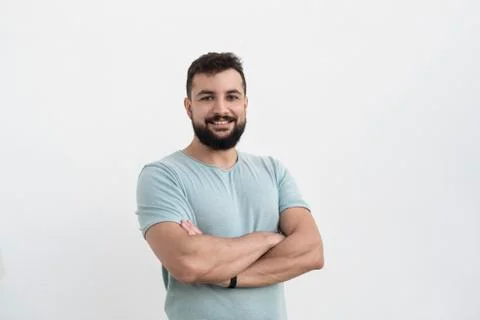 Bearded man with white wall background, outdoors shot Stock Photos