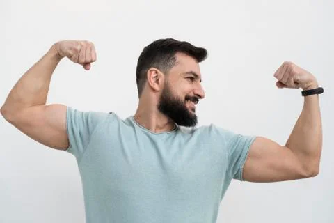 Bearded man with white wall background, outdoors shot Stock Photos