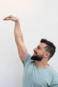 Bearded man with white wall background, outdoors shot Stock Photos