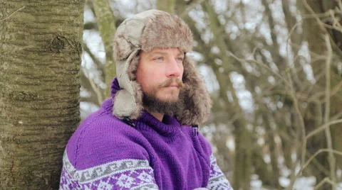 A bearded man in the winter woods. Healthy young bearded man in nature. Stock Footage 59647213