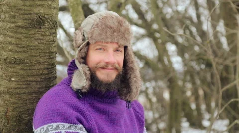 A bearded man in the winter woods. Healthy young bearded man in nature. Stock Footage 59658418
