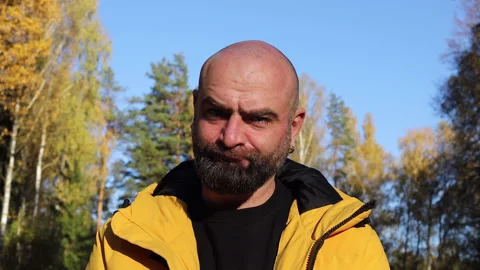 Bearded man in yellow jacket shaking Head to reject Stock Footage 163268875