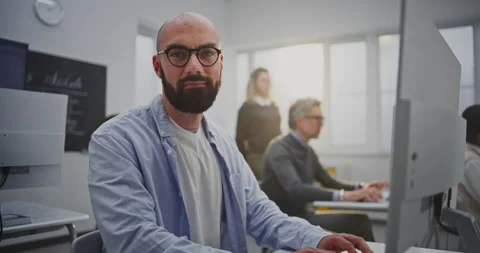 Bearded Mature Man in Computer Lab Attends Programming Lesson Stock Footage 321250005