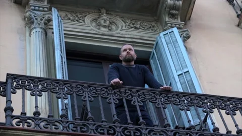 Bearded middle age man standing on the balcony Stock Footage 152401898