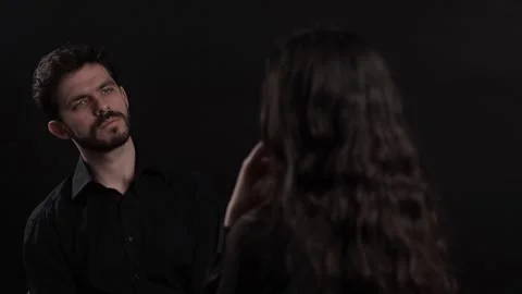 Bearded Middle Aged Businessman Getting Interviewed by a Businesswoman on Black Video stock 241326107