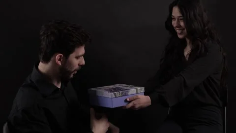 Bearded Middle Aged Businessman Getting a Present from a Businesswoman Stock Footage 241326152