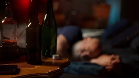 Bearded middle-aged man sleeps after drinking, struggling with midlife crisis Stock Footage 342520790
