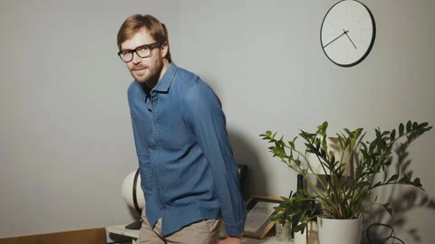 Bearded model posing at office near paper desk Stock Footage 146129382