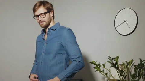 Bearded model posing at office near paper desk Stock Footage 146129442