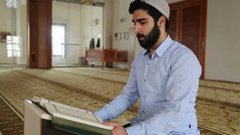 Bearded Muslim Man Reading Holy Quran in Mosque Stock Footage 346474468