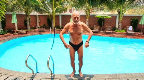 Bearded Old Man Laughs Dives Backward into Pool Video stock 65030644