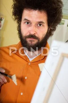 Bearded painter in his studio Stock Photos