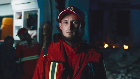 Bearded paramedic on disaster site Stockbeeldmateriaal 166144449