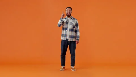 Bearded pensive guy in plaid shirt, holding hand on face, reasoning over problem Stock Footage 259489286