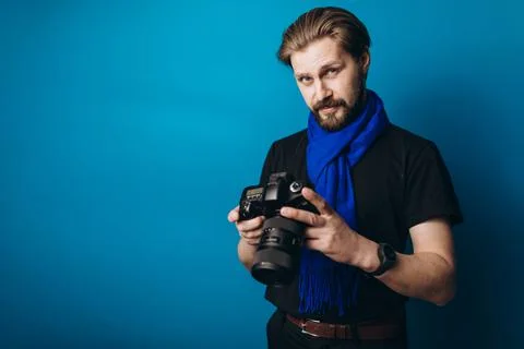 Bearded photographer using camera Stock Photos