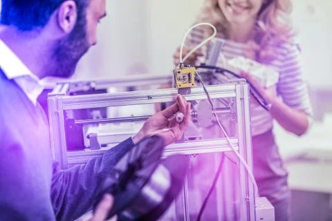 Bearded programmer feeling excited while working on developing new software Stock-Fotos