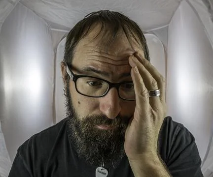 A bearded sad looking man in a depressive mood Stock Photos