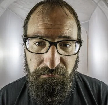 A bearded sad looking man in a depressive mood Stock Photos