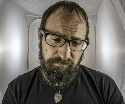A bearded sad looking man in a depressive mood Stock Photos