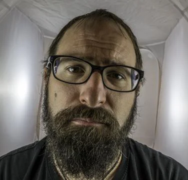 A bearded sad looking man in a depressive mood Stock Photos