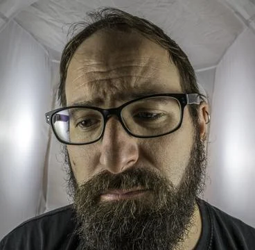 A bearded sad looking man in a depressive mood Stock Photos