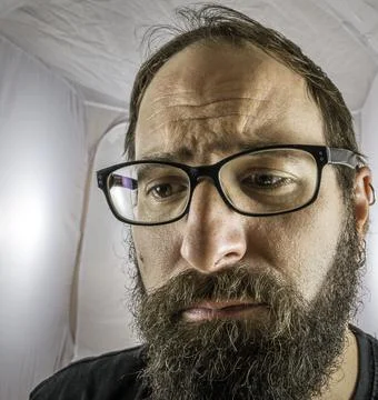 A bearded sad looking man in a depressive mood Stock Photos