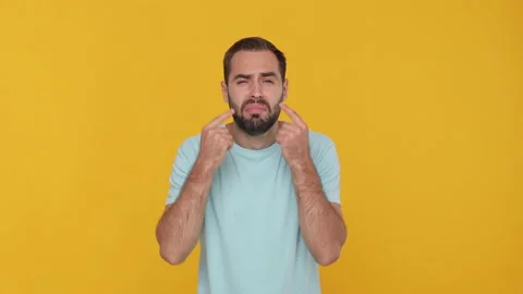 Bearded sad weak fuss young man 20s in basic casual blue t-shirt isolated on Stock Footage 148288203