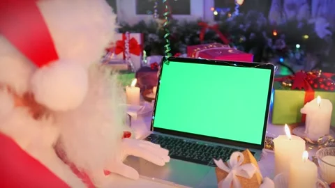 Bearded Santa Claus using laptop computer with green chroma key screen Stock Footage 255850675