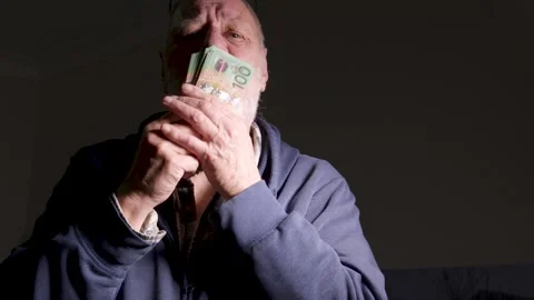 Bearded Senior Man Ecstatic While Kissing Wad of Money Stock Footage 345271824