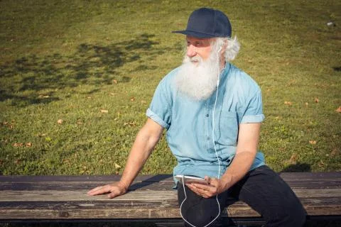 Bearded senior man using tablet Stock Photos